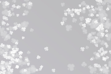 Fototapeta premium Abstract bokeh background with clubs pattern on grey background.