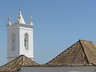 Fototapeta na wymiar Tavira (Portugal). Bell tower of one of the churches of the town of Tavira