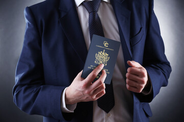 Businessman holds a Saint Kitts and Nevis passport, citizenship by investment