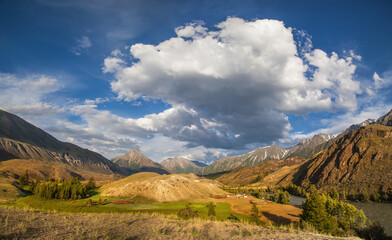 Fototapeta premium Valley in the Altai mountains on a summer day, picturesque sky with clouds