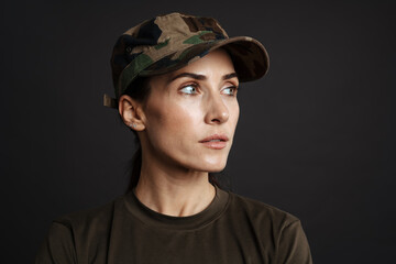 Happy beautiful soldier woman standing isolated