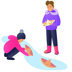 Two boys make paper boats and float them down a stream. It`s spring, the snow is already starting to melt, but it is still cold outside. Children are dressed in warm clothes.