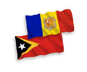 National vector fabric wave flags of East Timor and Andorra isolated on white background. 1 to 2 proportion.