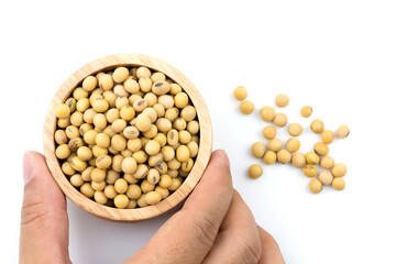 Healthy soybeans In a wooden cup On white background