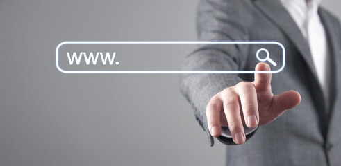 Male hand pressing Search button. Internet