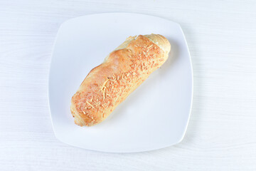 Freshly baked bakery displayed on white wooden background
