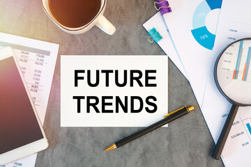 Naklejka premium FUTURE TRENDS is written in a document on the office desk, coffee, diagram and smartfon