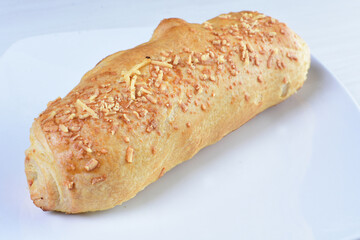 Freshly baked bakery displayed on white wooden background