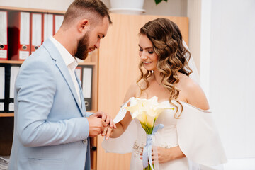 Fototapeta premium couple of newlyweds in the civil registry office.