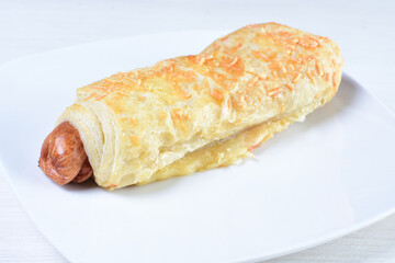 Freshly baked bakery displayed on white wooden background