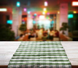 Napkin on wooden desk. Pizzeria background mockup perspective.