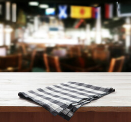 Napkin on wooden desk. Pizzeria background mockup perspective.