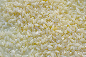 Yellow white rice grains for close-up cooking