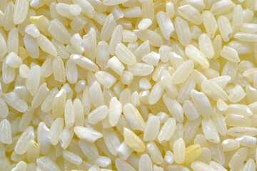 Yellow white rice grains for close-up cooking