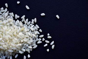 Crumbled white rice on a black background