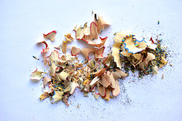 Rubbish from turning colored pencils on a white background