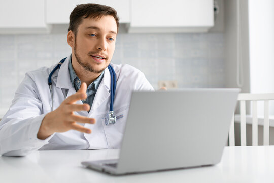 Photo of a doctor talks to the patient during an online consultation.