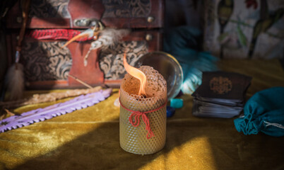Magic scene, Mystical atmosphere, candle and other stuff on the table, esoteric concept 