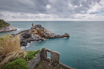 Portovenere (Porto Venere) in Liguria, Italy: beautiful aerial scenic view of the Church of St....