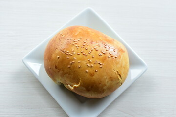Freshly baked bakery displayed on white wooden background