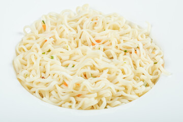 A white plate full of delicious noodles pasta