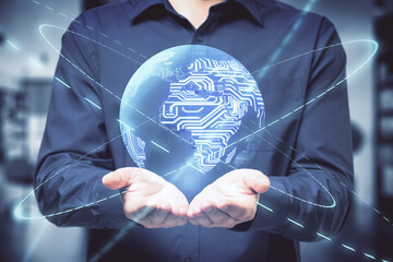 Big data and global communication concept with man hands and digital Earth planet with microchip scheme inside and glowing rings around