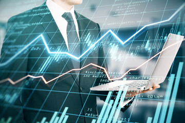 Stock market analysis in process with businessman looking after forex chart changes and digital financial graphs with diagram