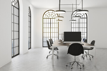 Modern monochrome style meeting room with conference table with computers, black chairs and arched...