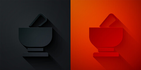 Paper cut Mortar and pestle icon isolated on black and red background. Paper art style. Vector.