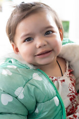 Asian Indian baby girl portrait closeup. A cute baby girl with beautiful smile one to three years old 