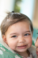 Asian Indian baby girl portrait closeup. A cute baby girl with beautiful smile one to three years old 