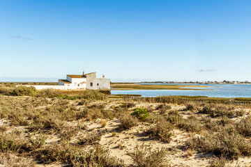 Tide mill building in Ria Formosa Natural Park, Olhao, Algarve, Portugal