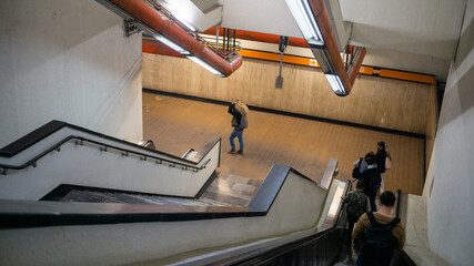 People going down on escalators in the Mexico City subway