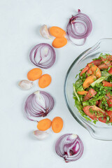 A glass plate of delicious vegetable salad