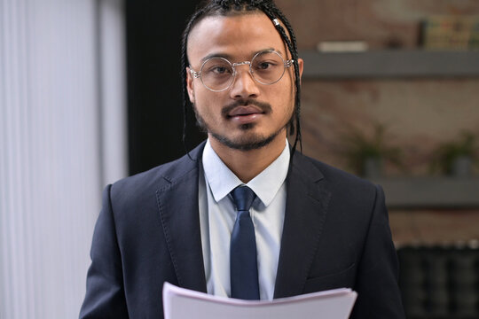 Young Black Man, Extraordinary Office Employee Looks Into The Camera With A Confident Look, Portrait Of A Young Leader