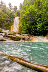 Blue water flowing through Gemelas waterfalls in Bajos del Toro, Costa Rica