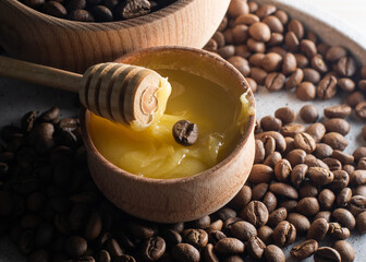 honey and coffee beans on wood background, abstract