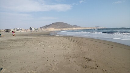 Playa, Arena, Mar, Persona, Cielo y Cerro