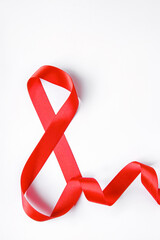 Number 8 from red silk ribbon on a white background. International women's day symbol. Spring holiday on March 8.