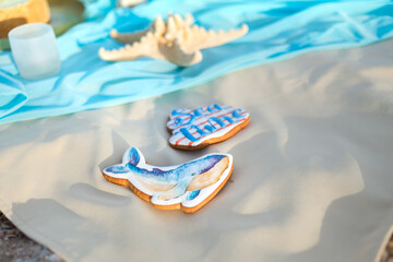 Sweet gingerbread in the shape of a whale in a marine style.
