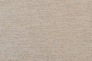 Plastered surface of a wall with light gray grooves. in Brazil known as grafiato. horizontal cut