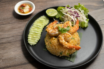 Prawn Fried Rice with folk and spoon on marble background ready to eat