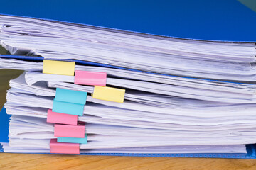 Close up Stack of papers files piles with documents achieves with paper clips