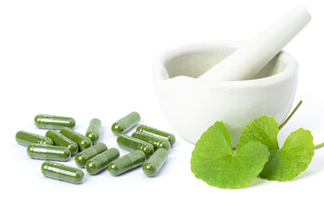 Gotu Kola leaf ( Asiatic pennywort, Indian pennywort, Centella asiatica ) and powder capsules isolated on white