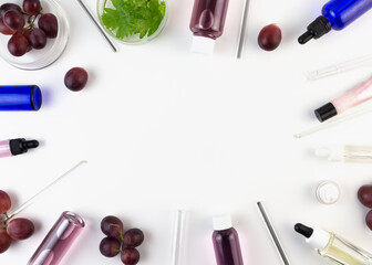 Obraz na płótnie Canvas Organic bio grape cosmetics. Extract, grape seed oils, serum. Abstract cosmetic laboratory. Flat lay