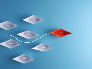 New ideas, creativity and various innovative solutions, paper boats on blue, leadership concept