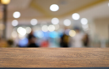 Empty wooden table in front of abstract blurred background of coffee shop . can be used for display or montage your products.Mock up for display of product