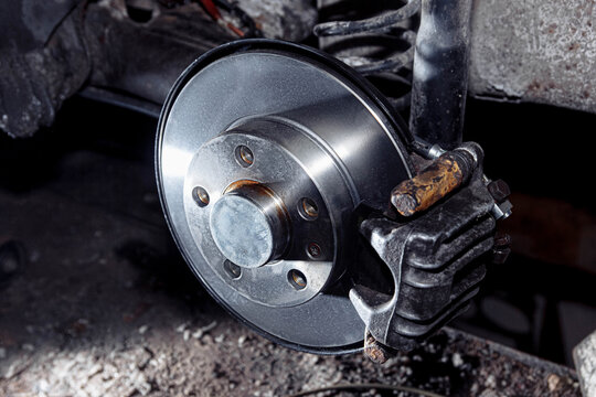 New car brake disc, brake system repair concept in garage