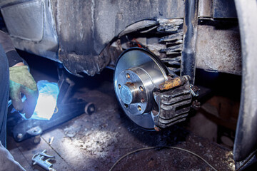 Fototapeta premium New car brake disc, brake system repair concept in garage