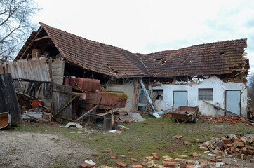 Collapsed and destroyed building ruins after devastating earthquake. Debris. Demolished house in...